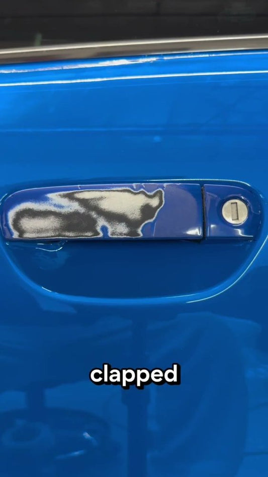 Blue vinyl wrap on a car door handle - Aura Vinyl