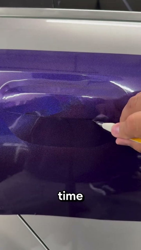 Door handle vinyl wrap technique on a silver car - Aura Vinyl