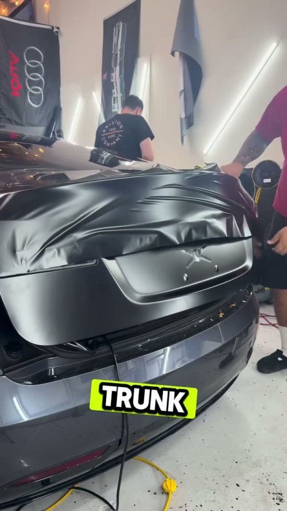 Grey vinyl wrap on a Tesla Model 3 trunk - Aura Vinyl