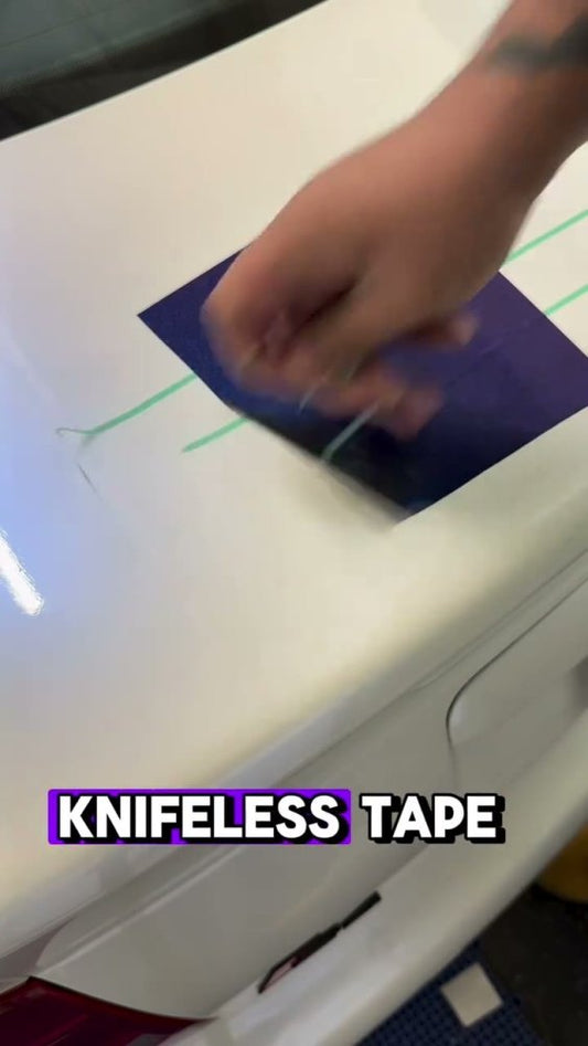 Pulling knifeless tape on a white Audi S4 - Aura Vinyl