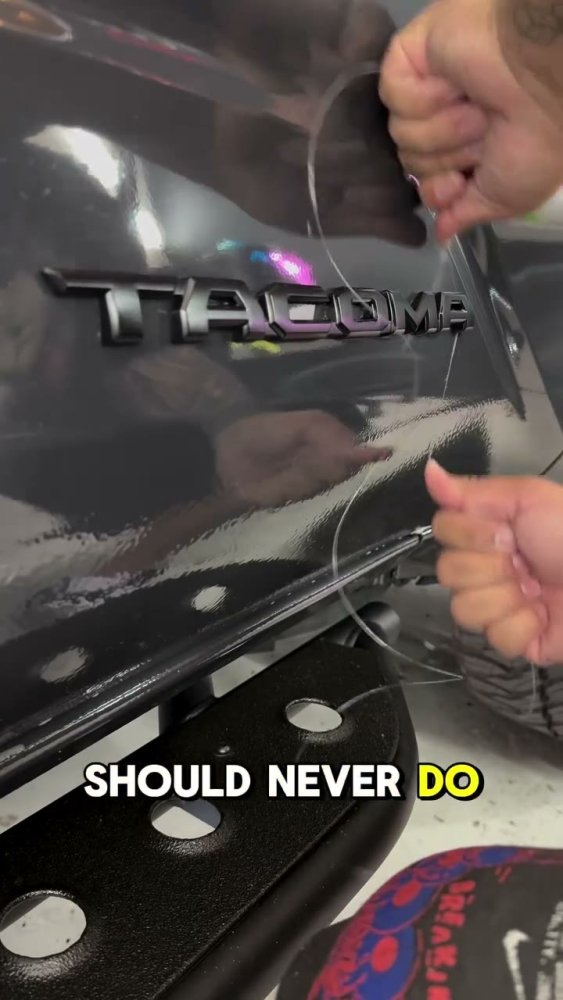 Toyota Tacoma emblem removal before vinyl wrap - Aura Vinyl