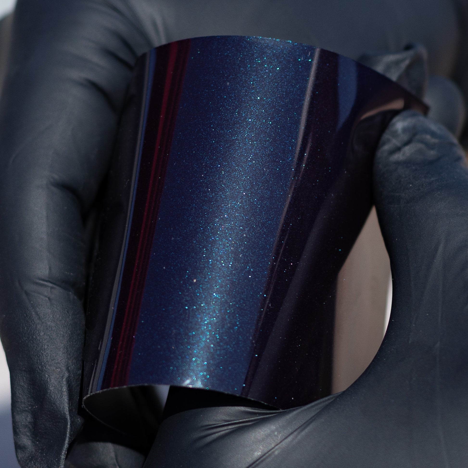 Aura Vinyl's "Gloss Diamond Black Blue Shift" car wrap