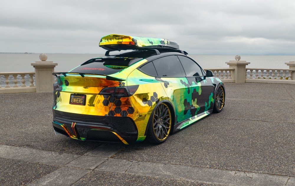Colorful car with a roof rack on a coastal road